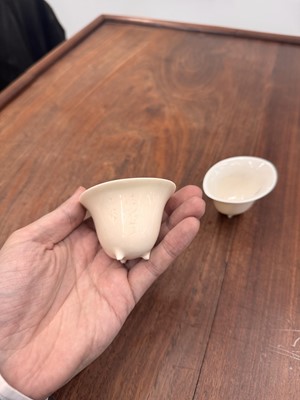 Lot 90 - Two Chinese Dehua inscribed cups, Qing dynasty, 17th/18th century