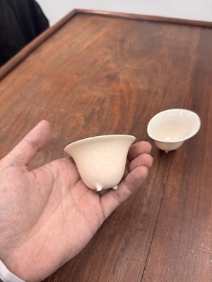 Lot 90 - Two Chinese Dehua inscribed cups, Qing dynasty, 17th/18th century