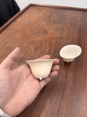 Lot 90 - Two Chinese Dehua inscribed cups, Qing dynasty, 17th/18th century