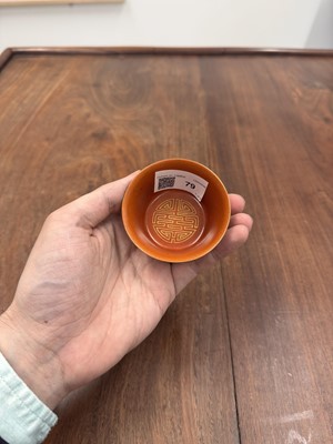 Lot 79 - A pair of Chinese coral-ground gilt-decorated cups, Qing dynasty, Yongzheng marks