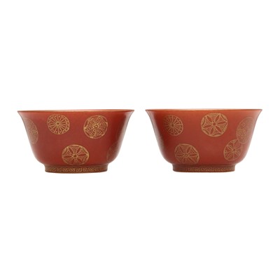 Lot 79 - A pair of Chinese coral-ground gilt-decorated cups, Qing dynasty, Yongzheng marks