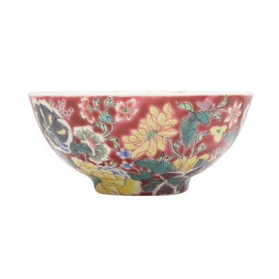 Lot 356 - A Chinese famille-rose ruby-ground 'floral' bowl, Qing dynasty, 19th century