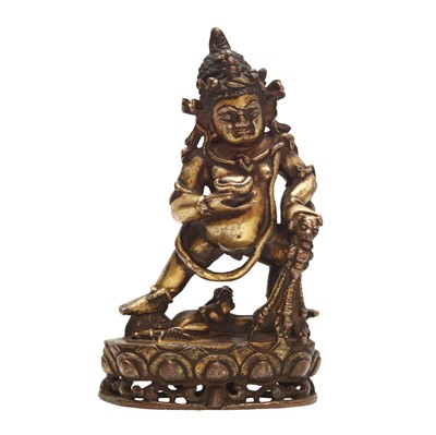 Lot 97 - A Tibetan gilt-bronze figure of Jambhala, 15th-16th century