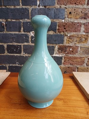 Lot 86 - A Chinese monochrome celadon-glazed garlic-mouth vase, suantouping, Qing dynasty, Qianlong mark