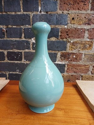 Lot 86 - A Chinese monochrome celadon-glazed garlic-mouth vase, suantouping, Qing dynasty, Qianlong mark