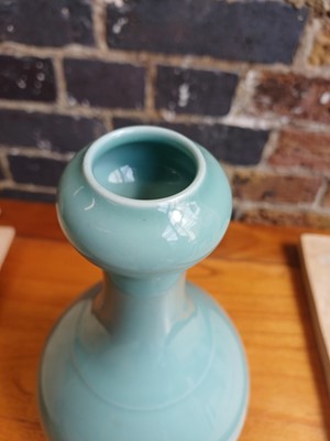 Lot 86 - A Chinese monochrome celadon-glazed garlic-mouth vase, suantouping, Qing dynasty, Qianlong mark