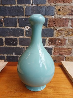 Lot 86 - A Chinese monochrome celadon-glazed garlic-mouth vase, suantouping, Qing dynasty, Qianlong mark
