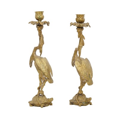 Lot 297 - A pair of 19th century candlesticks modelled with heron over turtle