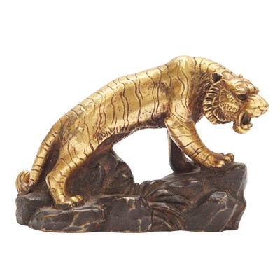 Lot 851 - A Japanese parcel-gilt bronze figure of a tiger, Meiji period
