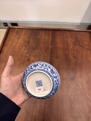 Lot 54 - A Chinese Ming-style blue and white 'lotus bouquet' saucer, Qing dynasty, Daoguang mark and of the period