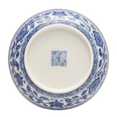 Lot 54 - A Chinese Ming-style blue and white 'lotus bouquet' saucer, Qing dynasty, Daoguang mark and of the period