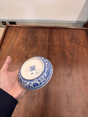 Lot 54 - A Chinese Ming-style blue and white 'lotus bouquet' saucer, Qing dynasty, Daoguang mark and of the period