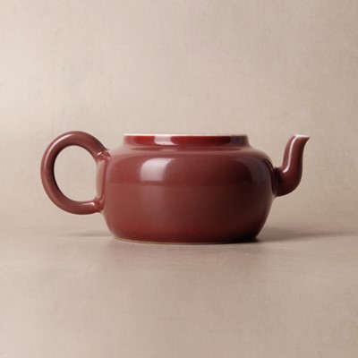 Lot 48 - A Chinese monochrome copper-red teapot, Yongzheng mark and possibly of the period