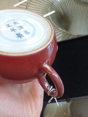 Lot 48 - A Chinese monochrome copper-red teapot, Yongzheng mark and possibly of the period