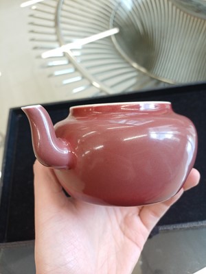 Lot 48 - A Chinese monochrome copper-red teapot, Yongzheng mark and possibly of the period