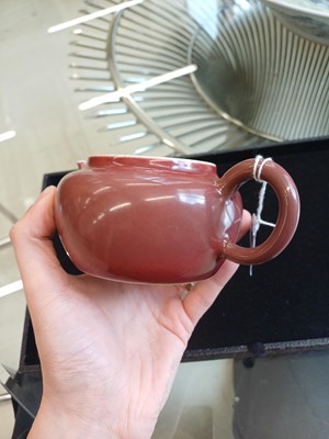 Lot 48 - A Chinese monochrome copper-red teapot, Yongzheng mark and possibly of the period
