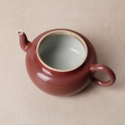 Lot 48 - A Chinese monochrome copper-red teapot, Yongzheng mark and possibly of the period