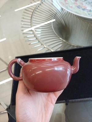Lot 48 - A Chinese monochrome copper-red teapot, Yongzheng mark and possibly of the period