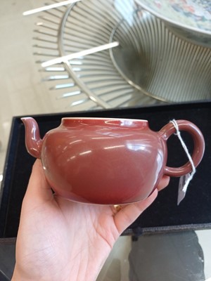 Lot 48 - A Chinese monochrome copper-red teapot, Yongzheng mark and possibly of the period