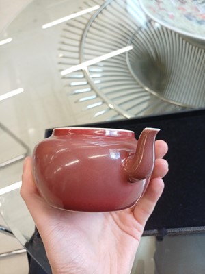 Lot 48 - A Chinese monochrome copper-red teapot, Yongzheng mark and possibly of the period