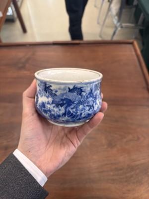Lot 93 - A Chinese blue and white 'dragon and carp' censer, Qing dynasty, 18th century