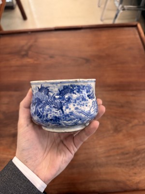 Lot 93 - A Chinese blue and white 'dragon and carp' censer, Qing dynasty, 18th century