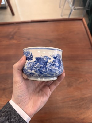 Lot 93 - A Chinese blue and white 'dragon and carp' censer, Qing dynasty, 18th century