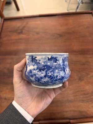 Lot 93 - A Chinese blue and white 'dragon and carp' censer, Qing dynasty, 18th century
