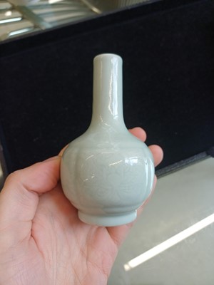 Lot 52 - A small Chinese monochrome white-glazed incised vase, Qing dynasty, Qianlong mark and period