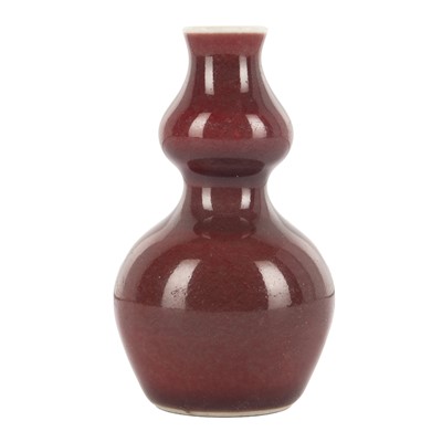 Lot 647 - A miniature Chinese monochrome copper-red-glazed vase, Qing dynasty, 19th century