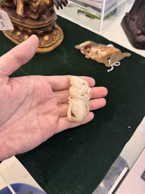 Lot 507 - A Chinese celadon jade 'dancer' carving, 20th century