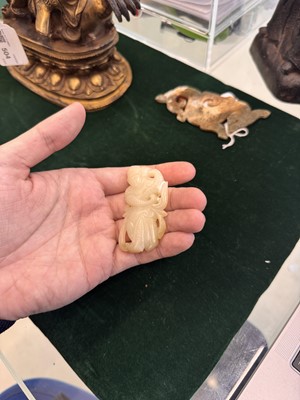 Lot 507 - A Chinese celadon jade 'dancer' carving, 20th century