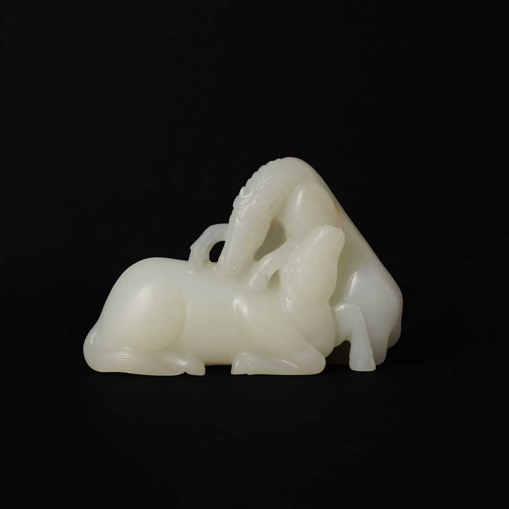 Lot 509 - A Chinese white jade 'horses' carving, late Qing dynasty