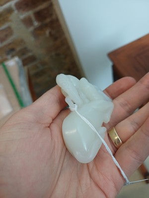Lot 509 - A Chinese white jade 'horses' carving, late Qing dynasty