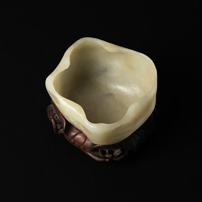 Lot 108 - A Chinese jade 'lotus' brush washer, Qing dynasty, 19th century