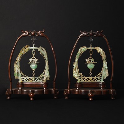 Lot 104 - A pair of Chinese jadeite 'hanging vase' carvings, Qing dynasty, 19th century