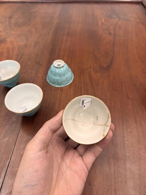 Lot 51 - Four Chinese turquoise-enamelled ogee wine cups, Qing dynasty, Qianlong marks and period