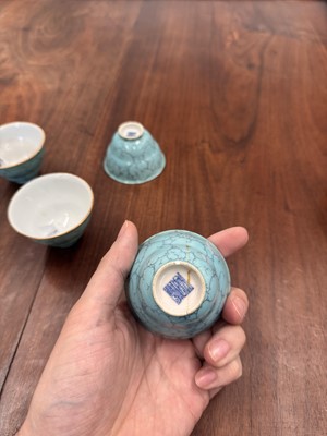Lot 51 - Four Chinese turquoise-enamelled ogee wine cups, Qing dynasty, Qianlong marks and period