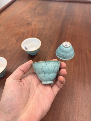 Lot 51 - Four Chinese turquoise-enamelled ogee wine cups, Qing dynasty, Qianlong marks and period