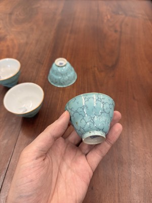 Lot 51 - Four Chinese turquoise-enamelled ogee wine cups, Qing dynasty, Qianlong marks and period