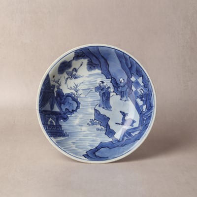 Lot 7 - A fine Chinese blue and white 'Sea house Addition' shallow bowl, Qing dynasty, Kangxi mark and of the period