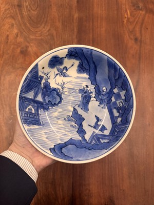 Lot 7 - A fine Chinese blue and white 'Sea house Addition' shallow bowl, Qing dynasty, Kangxi mark and of the period