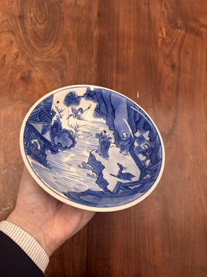 Lot 7 - A fine Chinese blue and white 'Sea house Addition' shallow bowl, Qing dynasty, Kangxi mark and of the period
