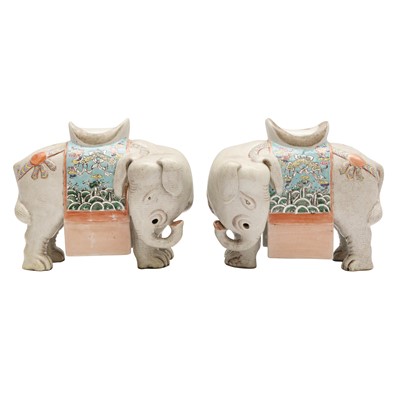 Lot 366 - A pair of Chinese famille-rose 'elephant' candle holders, Qing dynasty, 19th century