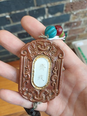 Lot 70 - A Chinese abstinence plaque, Qing dynasty, 19th century