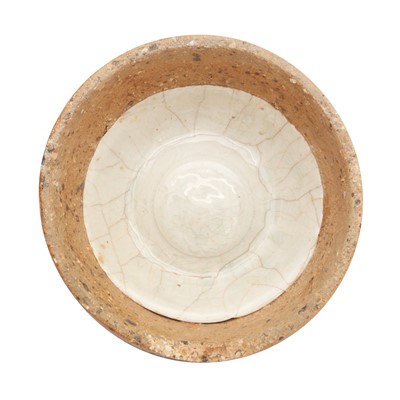 Lot 480 - A Chinese qingbai bowl in a saggar, Yuan dynasty