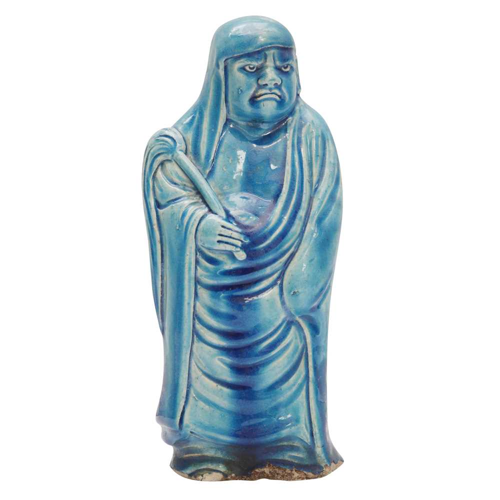Lot 34 - A Chinese monochrome turquoise-glazed figure of Daruma, Qing dynasty, Kangxi period