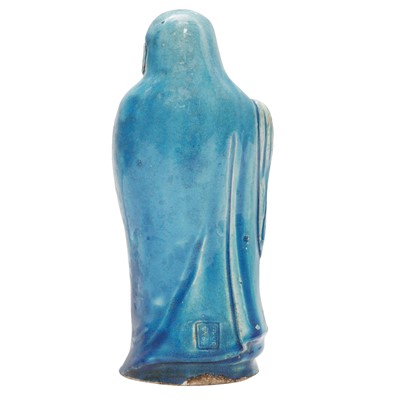 Lot 34 - A Chinese monochrome turquoise-glazed figure of Daruma, Qing dynasty, Kangxi period