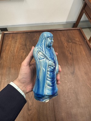 Lot 34 - A Chinese monochrome turquoise-glazed figure of Daruma, Qing dynasty, Kangxi period