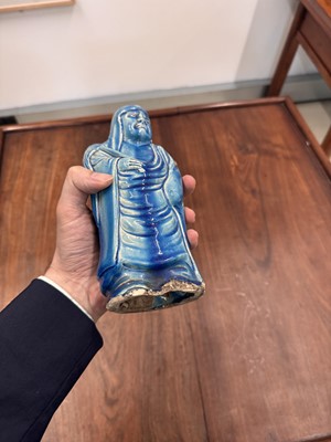 Lot 34 - A Chinese monochrome turquoise-glazed figure of Daruma, Qing dynasty, Kangxi period
